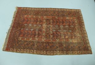 Eastern rug, worn red field with geometric motifs, 262 x 172cm.