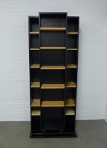 Modern ebonised and beech wood open bookcase, with sliding section, 90 x 224 x 57cm.