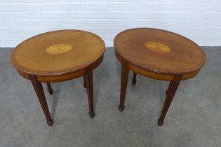 Pair of Sheraton Revival, reproduction mahogany tables with oval tops, raised on tapering legs