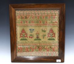 Victorian needlework sampler, worked by Mary Young, Aged 14, dated 1858, framed under glass with a