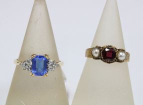 Edwardian unmarked yellow metal gemset ring and a modern gold plated dress ring (2)