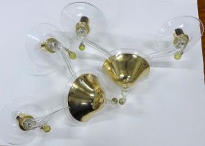A pair of contemporary glass twin arm wall lights with brass mounts and Murano type coloured glass