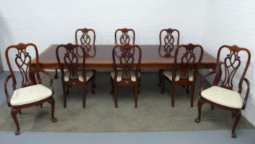 Mahogany extending dining table, with a drawer to one end, on shell carved cabriole legs with claw