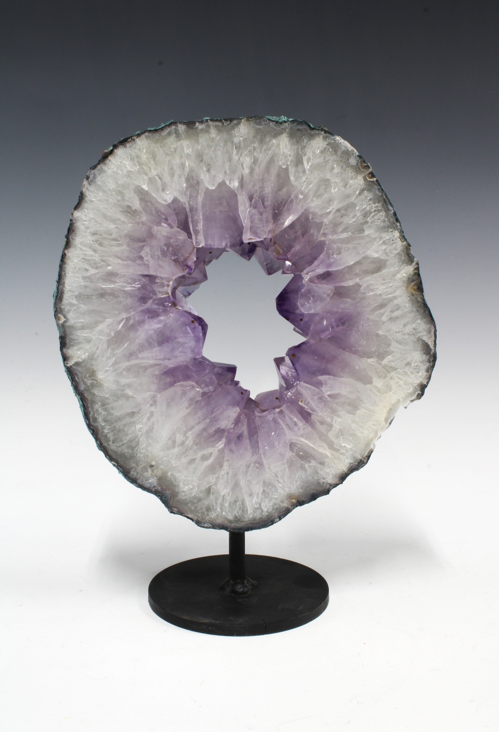 Amethyst Geode slice, on metal display stand, geode is 22 x 24cm