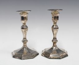 A pair of George VI silver candlesticks, on octagonal weighted bases, Sheffield 1941, 17cm high (2)
