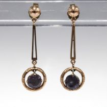 A pair of unmarked yellow metal gemset drop earrings (2)