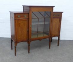 An Edwardian mahogany & inlaid cabinet, the higher central section with a glazed door with shelved