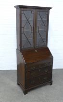 Mahogany bureau bookcase , dentil cornice over a pair of astragal glazed doors with a shelved