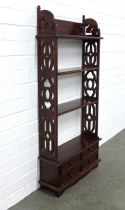 Mahogany open bookcase with fretwork side panels and four short drawers in the base, 51 x 110 x