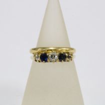 18ct gold wedding band and a diamond and sapphire ring, set in unmarked yellow metal (2)