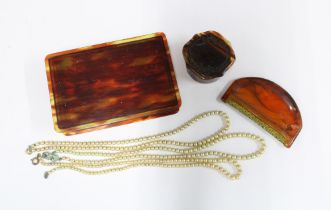 Rectangular tortoiseshell box containing three strands of vintage faux pearls and a smaller