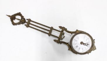 Mystery clock movement, gilt metal with circular enamel dial having roman and Arabic numerals,