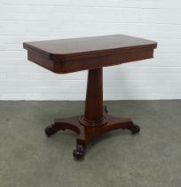 Mahogany foldover card table, baize interior, raised on a tapering cylindrical column with a