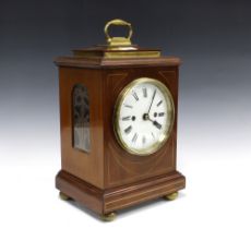 Mahogany cased mantle clock with brass carry handle, circular enamel dial with roman numerals,
