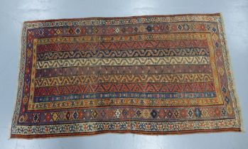 Eastern rug, with striped field 220 x 114cm.