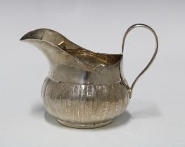 George III Irish silver cream jug, with fluted base, Dublin 1760, 9cm high