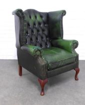 Green button back wing armchair, 92 x 104 x 57cm. (upholstery a/f)