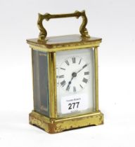 A small brass and glass cased carriage clock, 14cm