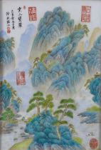 Chinoiserie porcelain plaque with red seal marks, in a stylised rectangular frame, 25 x 35cm