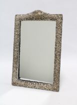 Late Victorian silver framed mirror with embossed flowerhead and foliage pattern, by Charles S Green
