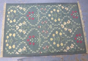 A pale green flatweave rug with foliate pattern, 235 x 162cm.