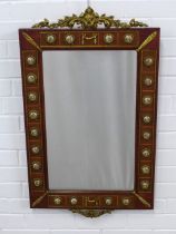 An ornate reproduction wall mirror, parcel gilt with faux porcelain plaques, 54 x 88cm.