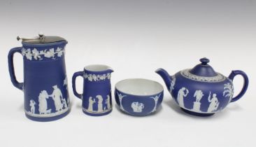 Wedgwood blue and white Jasperware to include a teapot, cream jug, sugar bowl and hot milk jug (4)