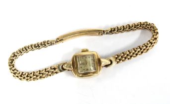 9ct gold Ladies Omega wrist watch, signed square dial, on a 9ct gold bracelet strap, stamped 375 and