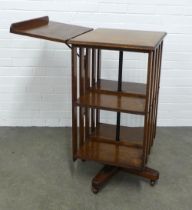 WITHDRAWN An Edwardian oak revolving bookcase with an adjustable folding reading lectern,