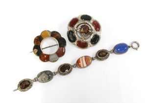A collection of Scottish coloured hardstone jewellery to include two brooches and a bracelet,