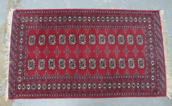 Pakistan Bokhara rug with red field, 170 x 95cm.