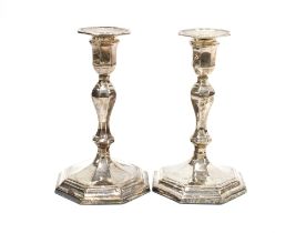 A pair of George VI silver candlesticks, on octagonal weighted bases, Sheffield 1941, 17cm high (2)