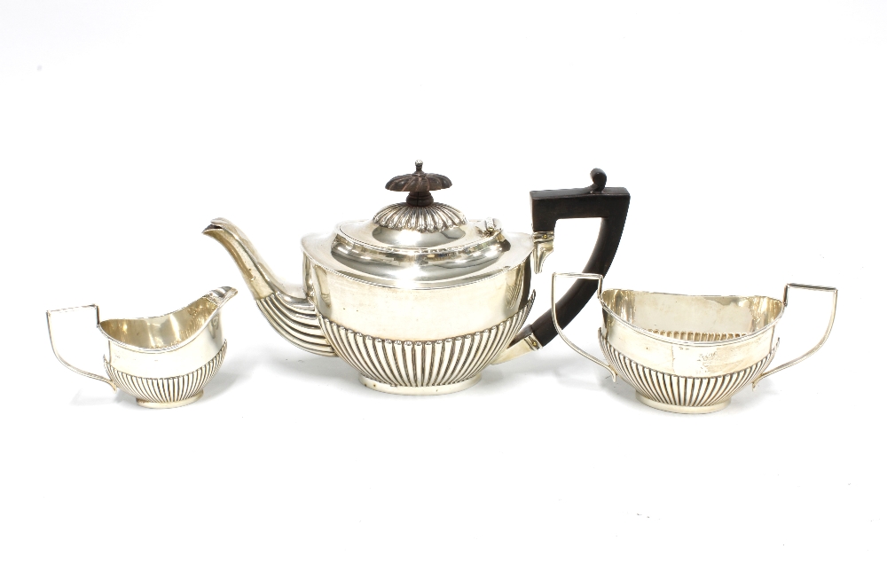 Edwardian three piece silver bachelors teaset, half fluted pattern, Birmingham 1902/03 (3)