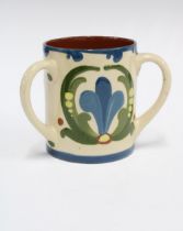 Torquay Ware Scandy pattern motto loving cup, inscribed Isn't your life extremely flat. Without