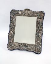An Art Nouveau style Britannia standard silver mirror, London 1998, rectangular form with embossed