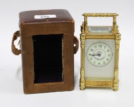 Brass and glass cased carriage clock, 14cm, in leather carry case