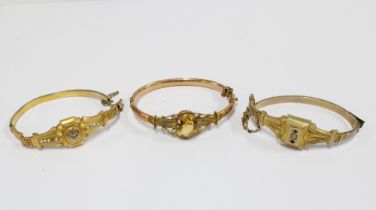 Two Victorian unmarked yellow metal bracelets together with another damaged bangle (3)