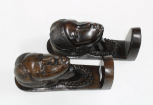 Pair of African carved hardwood bookends, 24cm (2)