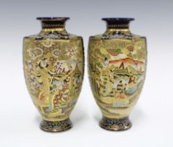 A pair of Japanese earthenware Satsuma style baluster vases (2) 25cm.