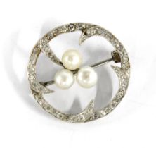 Diamond and pearl brooch set in a circular white metal open frame, unmarked, with a Hamilton &