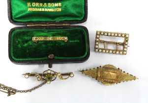 An antique yellow metal and seed pearl buckle brooch with inscribed date verso September 1898