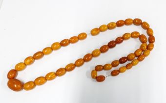 A strand of vintage butterscotch amber beads