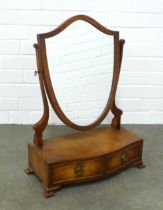 Mahogany dressing table mirror with shield shaped plate, the serpentine base with two short drawers,