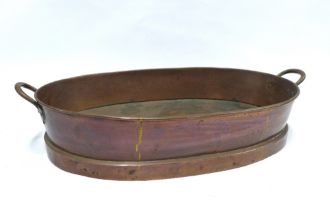 A large copper pan, oval with handles, late 19th century, 58 x 34cm.