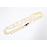 Double strand pearl necklace with a 9ct gold sapphire and seed pearl clasp, Birmingham 1975