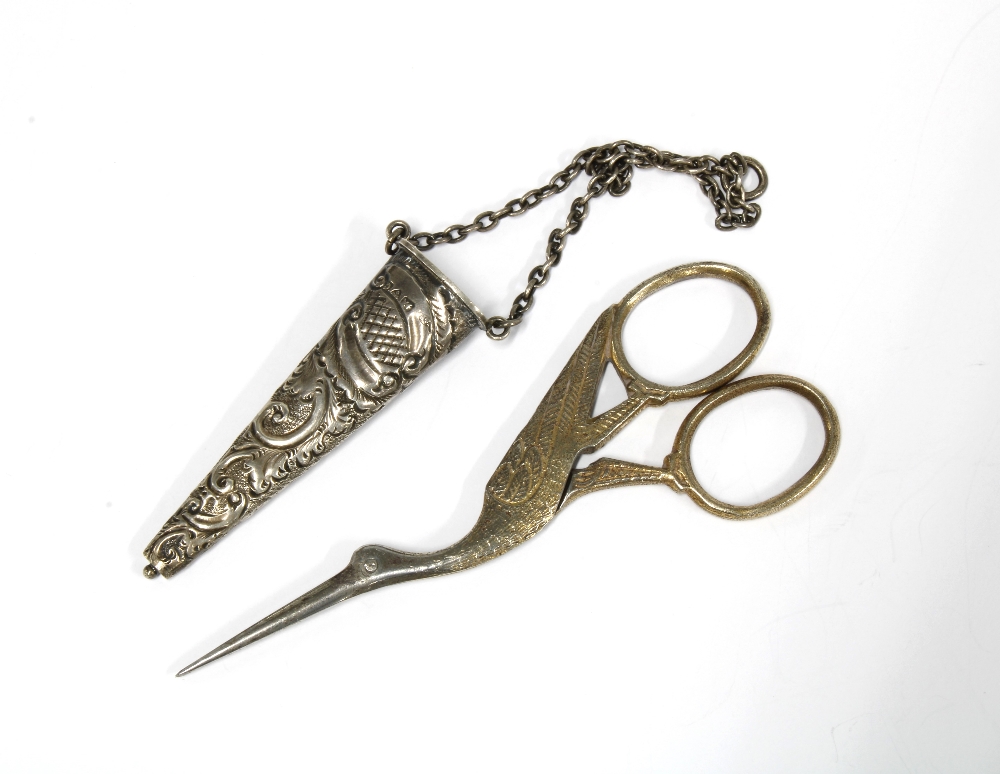 An Edwardian silver chatelaine case, Chester 1903, containing a pair of 'stork' scissors (2)