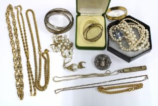 A vintage silver pendant, silver baby bangles, and a collection of costume jewellery to include gilt