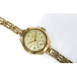 9ct gold Levicta ladies wristwatch with circular champagne dial with arabic numerals and