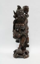 A Chinese carved wood figure of a Sage, 42.5cm high