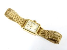 Movado, a lady's 18ct gold wristwatch with signed champagne dial with baton markers, on an 18ct gold